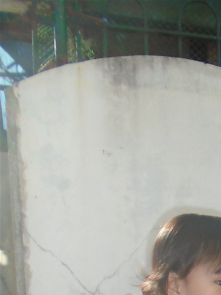 Outside the church with Amari. Face masks still a must in public in Nueva Ecija.